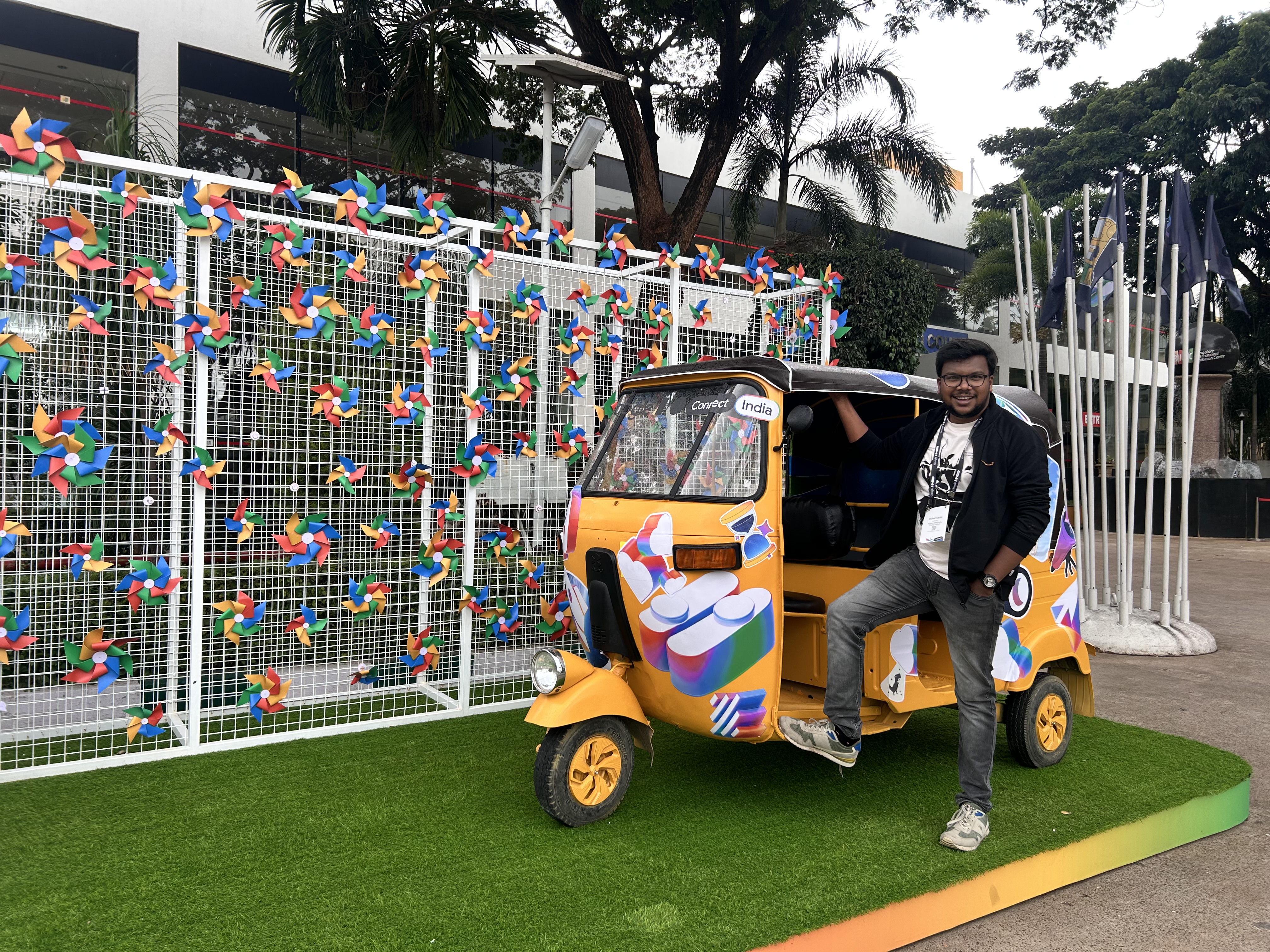 Shabul Hussain with auto rickshaw installation at Google IO Connect