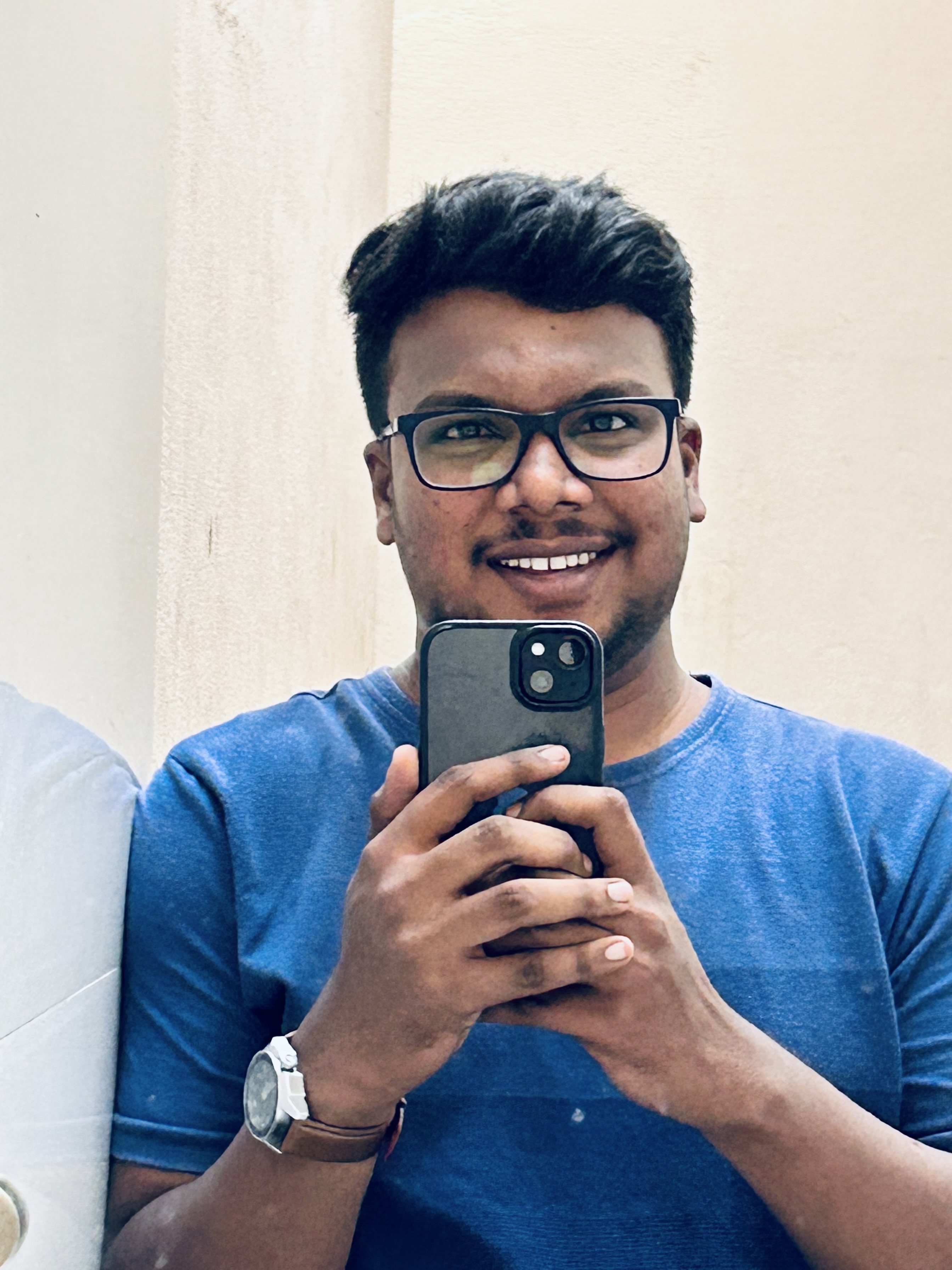 Shabul Hussain mirror selfie in blue t-shirt